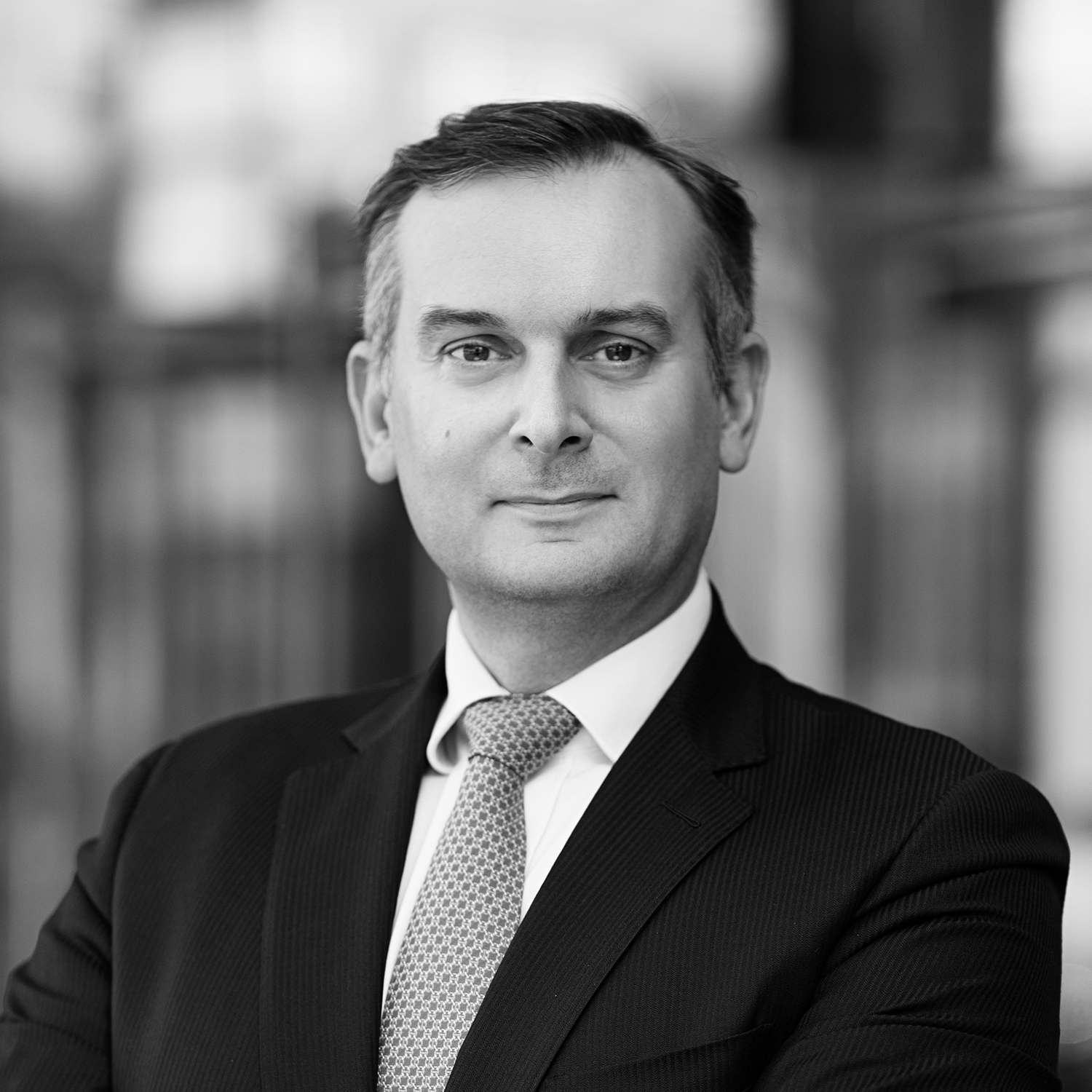 Black and white formal headshot of Gerald Carton.