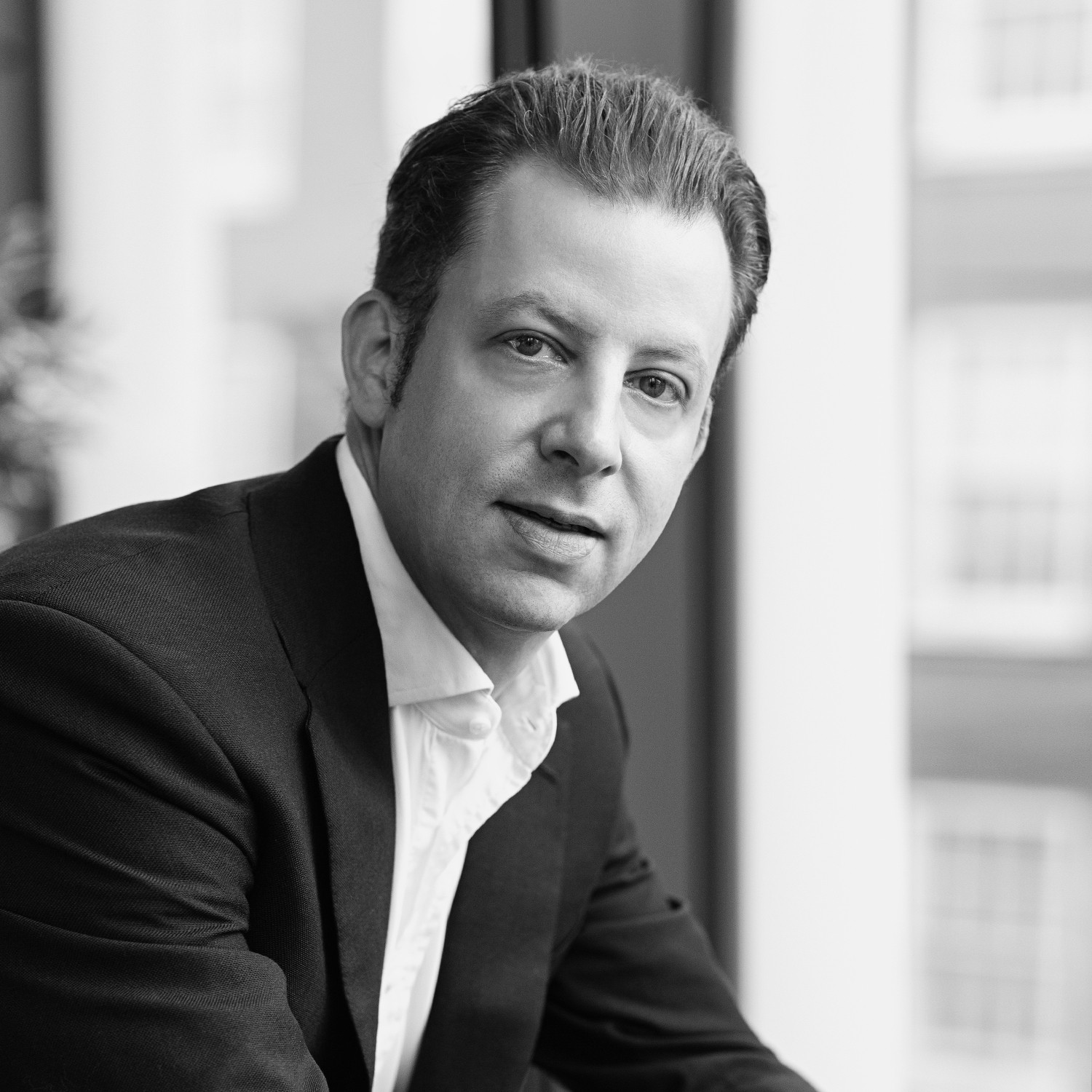 Black and white formal headshot of Michael Schad.