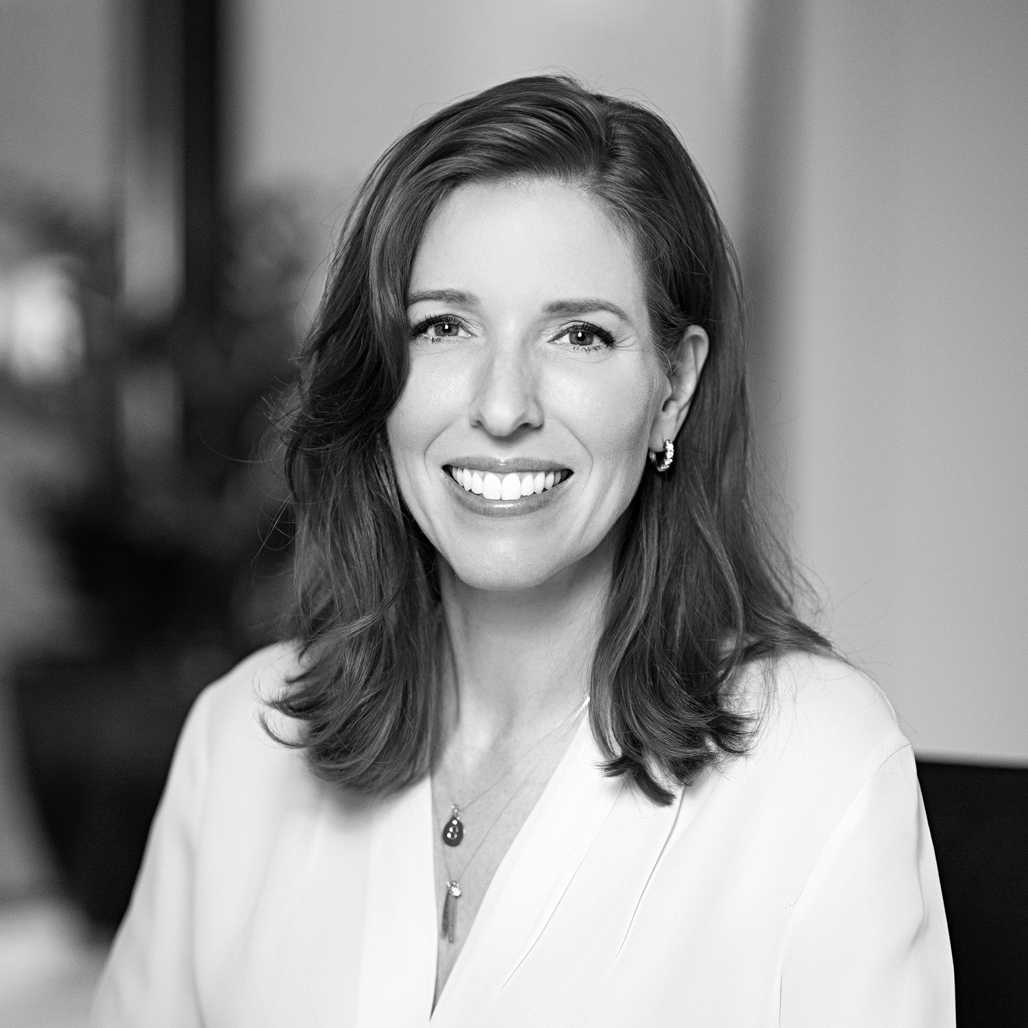 Black and white formal headshot of Paige Brotherton.