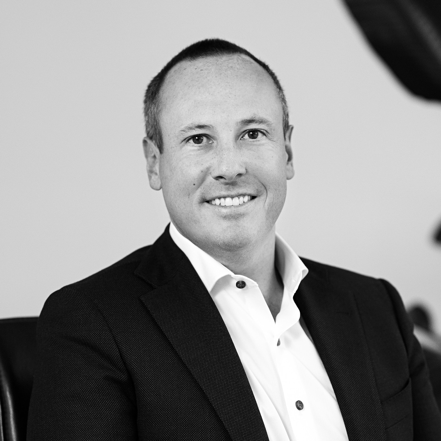 Black and white formal headshot of Eric Foran.